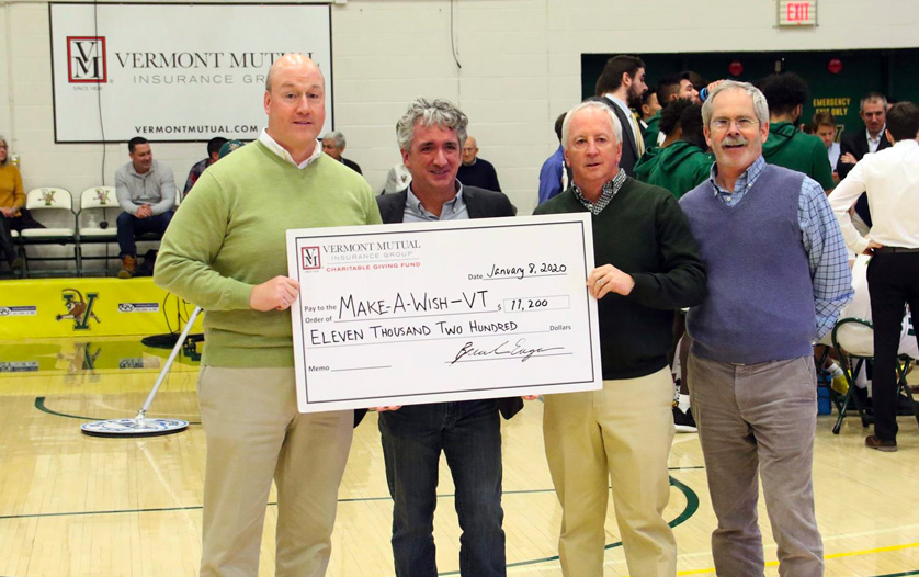 Vermont Mutual presenting large check to Make A Wish foundation